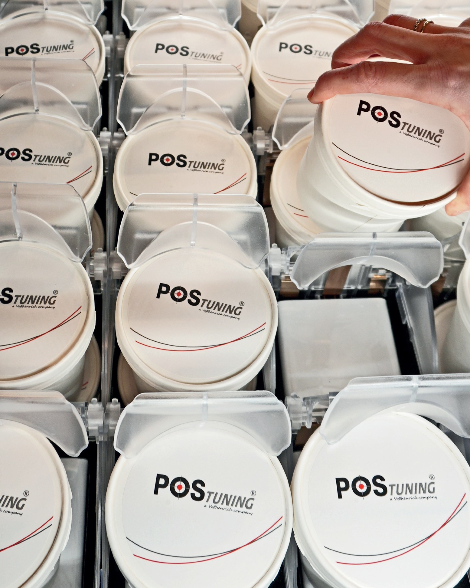 POS-T Skadi Lift installed in grocery chest freezer — ice cream cups elevated to grab height, fully visible and front-facing