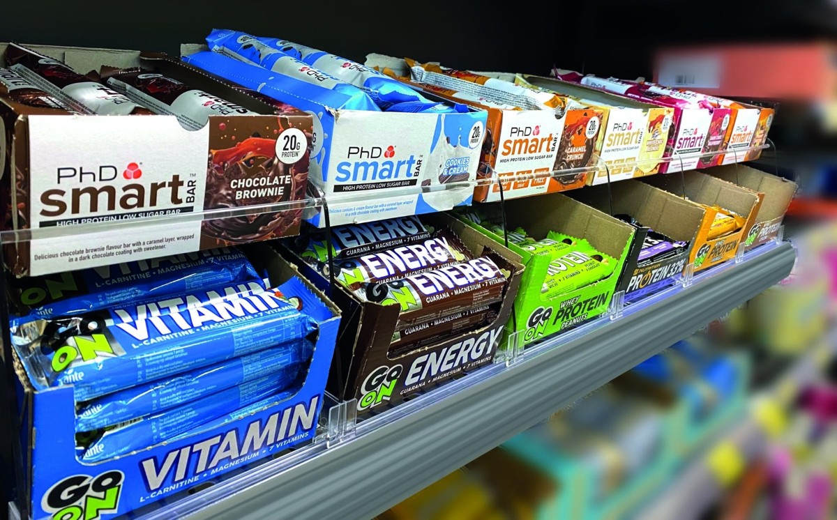 POS-T Double Tray System showing protein bar stacking opportunity on grocery gondola shelf